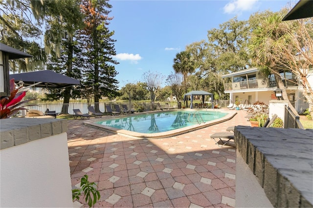 view of swimming pool with a patio