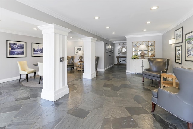 interior space with crown molding and ornate columns