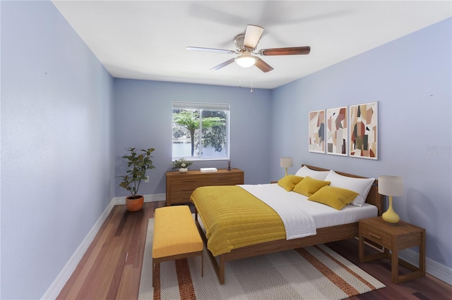 bedroom with hardwood / wood-style floors and ceiling fan