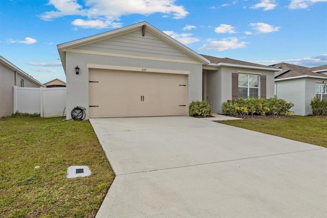 single story home with a garage and a front lawn