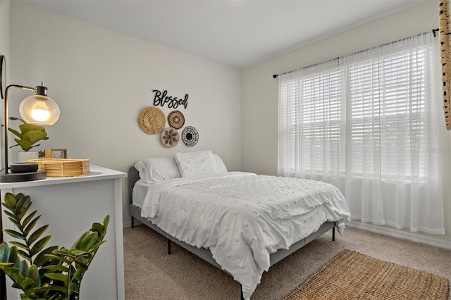 bedroom with light colored carpet