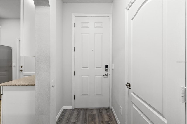 doorway to outside with dark wood-type flooring