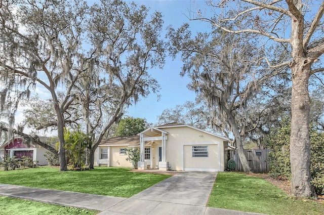 ranch-style house with a garage and a front yard