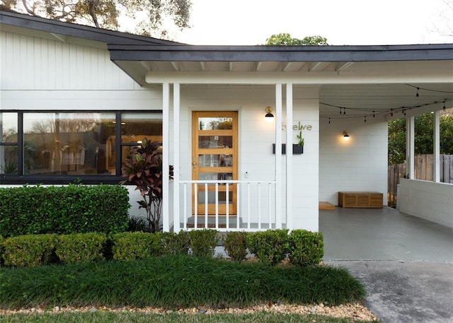 doorway to property with a carport