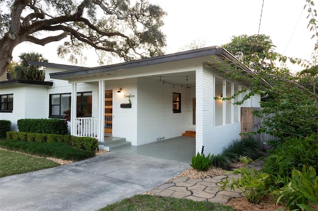 view of front facade featuring a carport and a porch