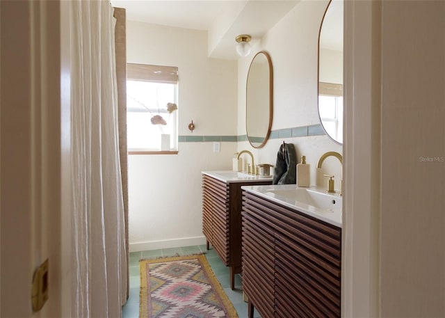 bathroom with vanity and tile patterned flooring