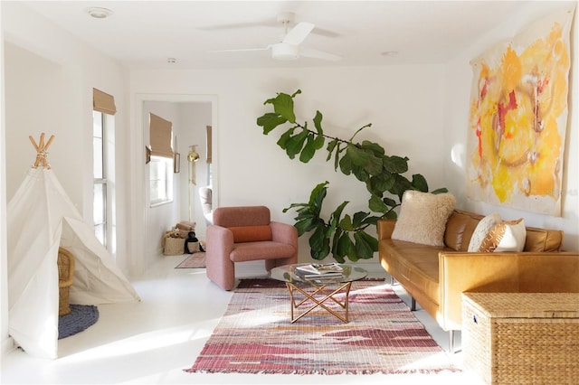 living area with ceiling fan