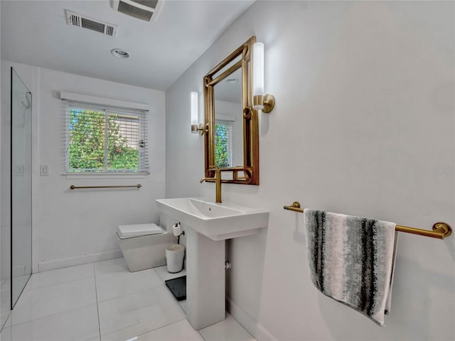 bathroom with toilet, tile patterned floors, visible vents, and baseboards