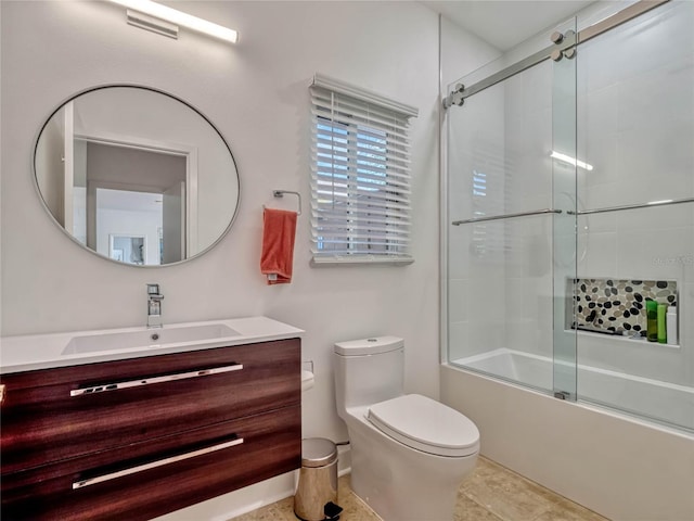 full bathroom featuring visible vents, combined bath / shower with glass door, vanity, and toilet