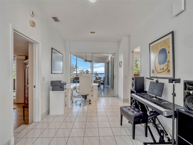 office featuring light tile patterned flooring and baseboards