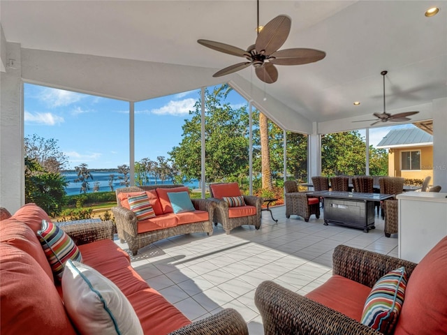 view of patio with outdoor dining area, a ceiling fan, and an outdoor living space