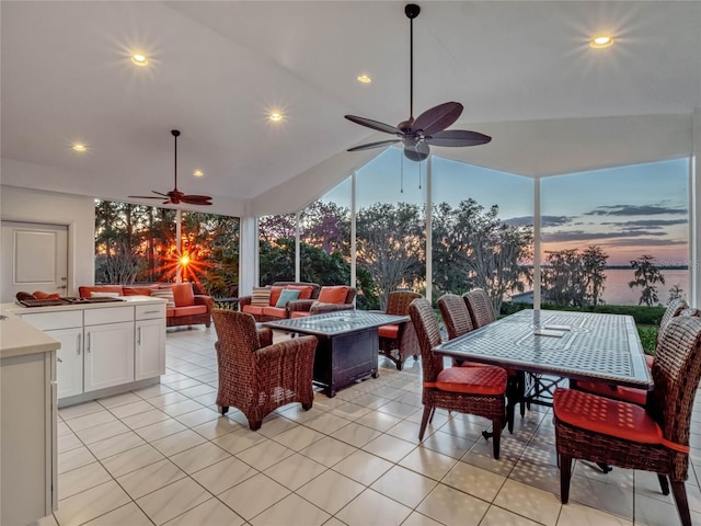 interior space with recessed lighting, ceiling fan, lofted ceiling, and light tile patterned floors