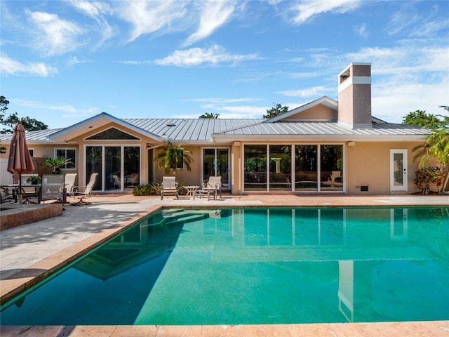 outdoor pool with a patio