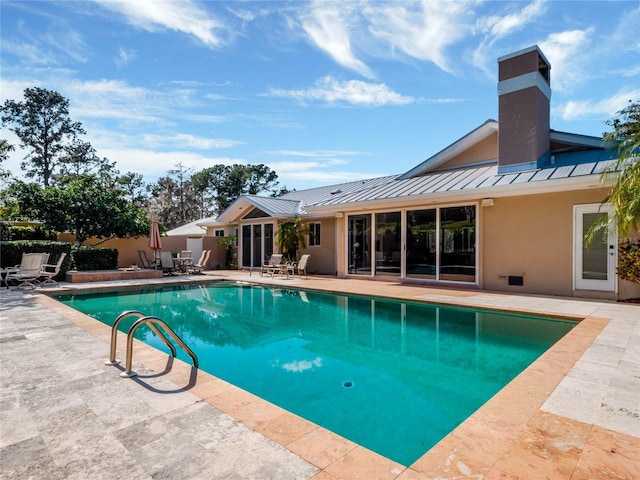 view of pool featuring a patio area, fence, and a fenced in pool