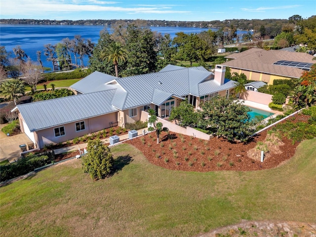 drone / aerial view with a water view