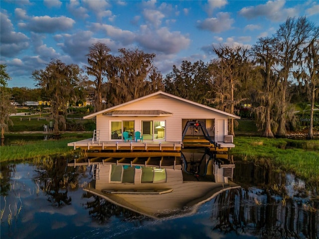 back of house featuring a water view