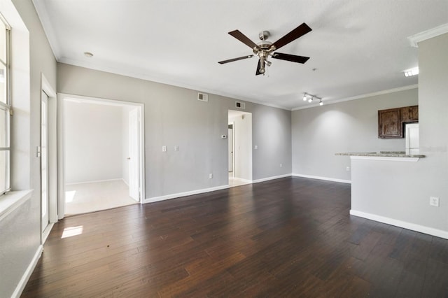 unfurnished living room featuring ornamental molding, ceiling fan, and dark hardwood / wood-style flooring