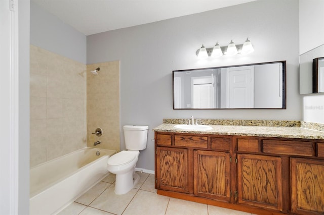 full bathroom featuring tile patterned flooring, vanity, tiled shower / bath combo, and toilet