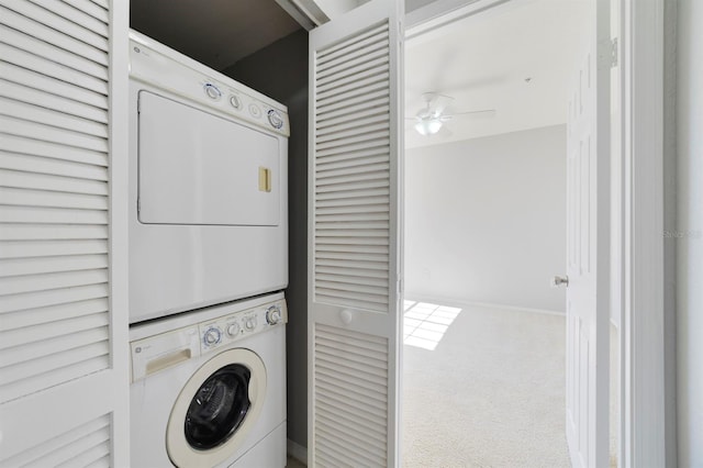 washroom with carpet floors, ceiling fan, and stacked washing maching and dryer