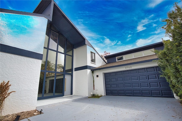 view of side of property with a garage