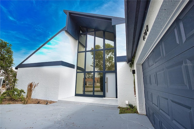 property entrance with a garage