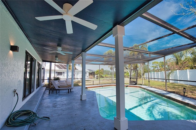 view of swimming pool with a patio and a lanai