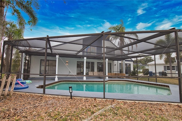 view of pool featuring a patio and glass enclosure