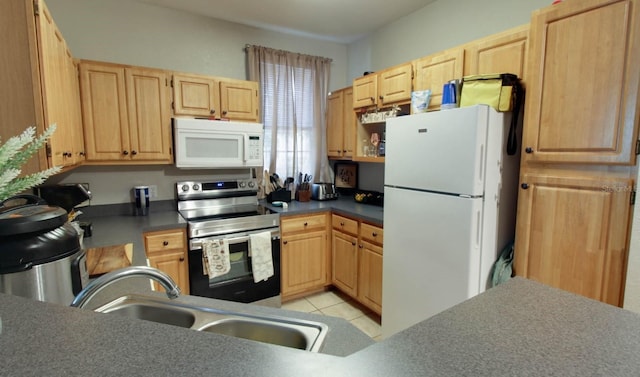 kitchen with white appliances, sink, light brown cabinets, and light tile patterned floors