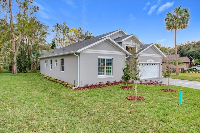 ranch-style home featuring a garage and a front yard