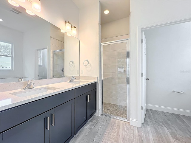 bathroom with vanity and an enclosed shower