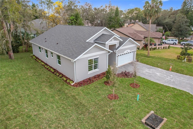 view of front of property with a garage and a front yard