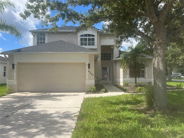 view of front facade with a garage and a front yard