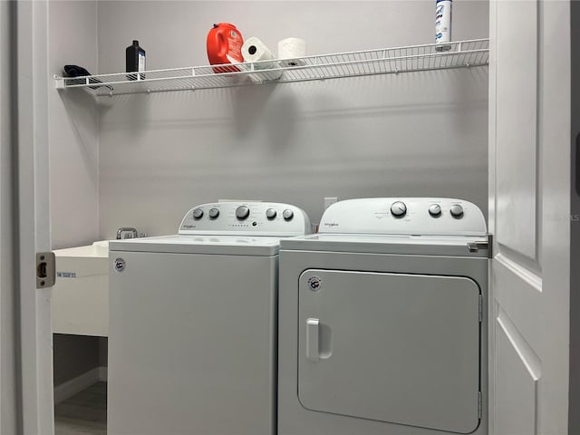 washroom featuring independent washer and dryer