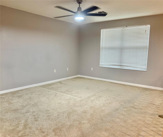 carpeted empty room with ceiling fan