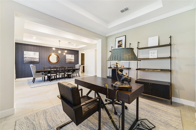 office space with ornamental molding, a raised ceiling, and light tile patterned floors