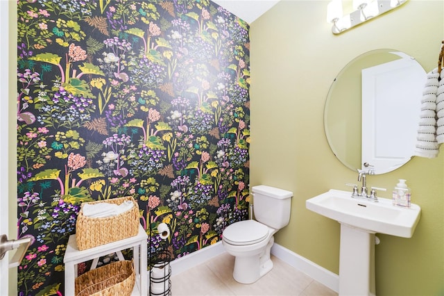 bathroom featuring tile patterned floors and toilet