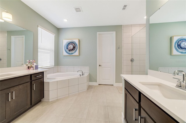 bathroom featuring vanity, tile patterned floors, and plus walk in shower