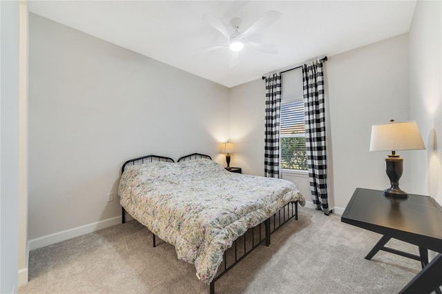 bedroom featuring light colored carpet and ceiling fan