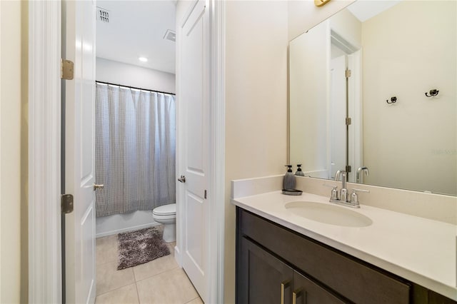 full bathroom with tile patterned flooring, shower / tub combo, vanity, and toilet