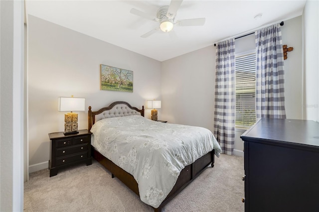 bedroom with light carpet and ceiling fan