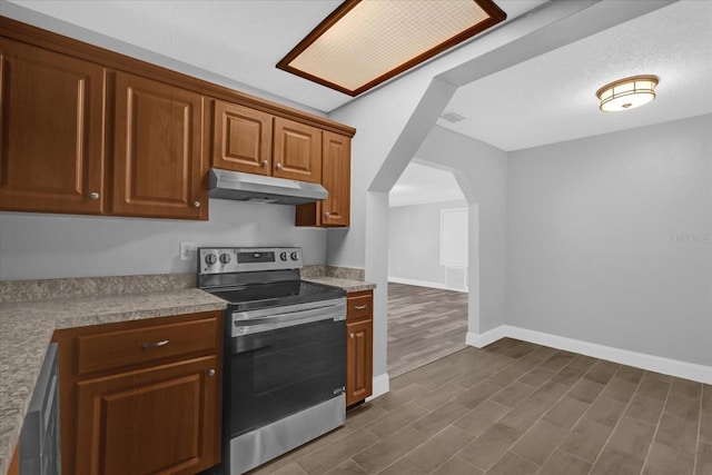 kitchen featuring stainless steel appliances and dark wood-type flooring