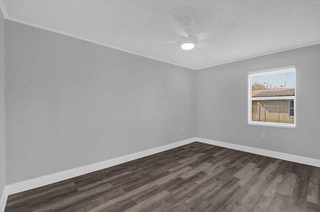 spare room featuring ornamental molding, ceiling fan, and dark hardwood / wood-style flooring