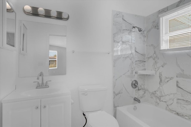 full bathroom featuring vanity, tiled shower / bath combo, plenty of natural light, and toilet