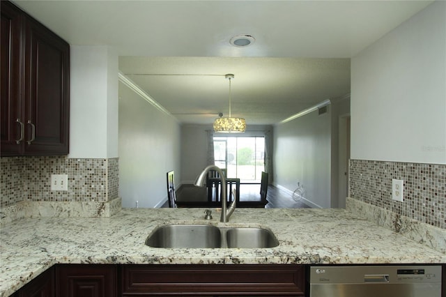 kitchen featuring dark brown cabinetry, dishwasher, and sink