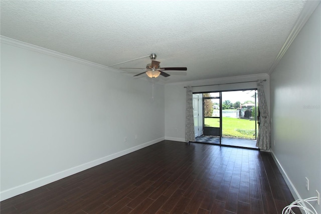 empty room featuring dark wood-type flooring, ornamental molding, and a textured ceiling