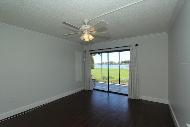 unfurnished room with ornamental molding, a water view, dark wood-type flooring, and ceiling fan