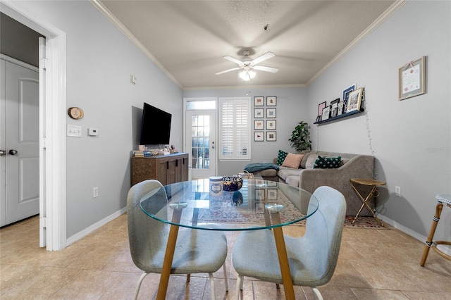 dining space featuring ornamental molding and ceiling fan