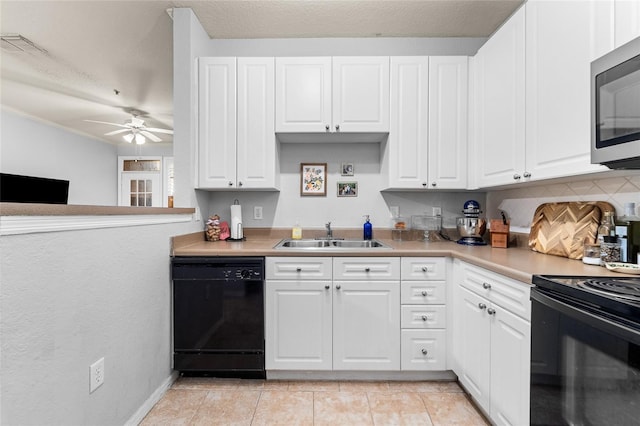 kitchen with tasteful backsplash, white cabinetry, sink, light tile patterned floors, and black appliances