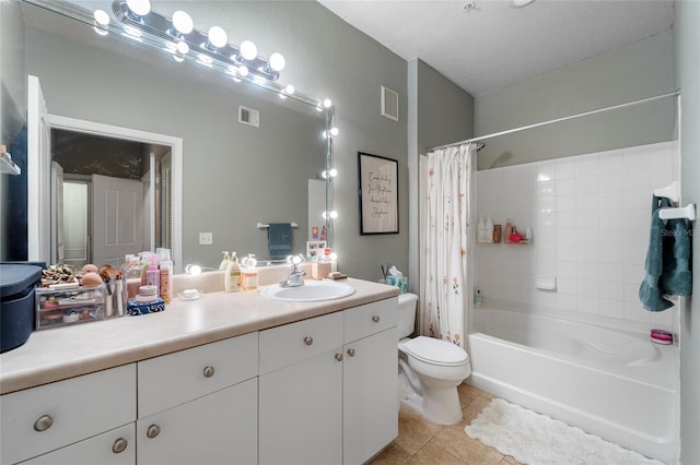 full bathroom with tile patterned flooring, shower / tub combo, vanity, a textured ceiling, and toilet