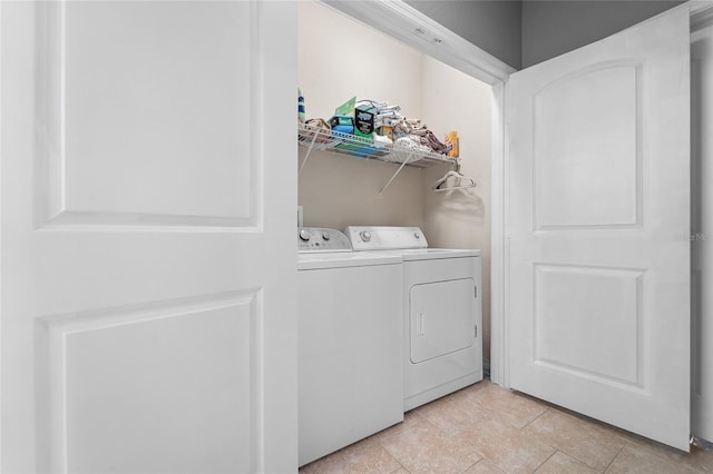 washroom featuring independent washer and dryer